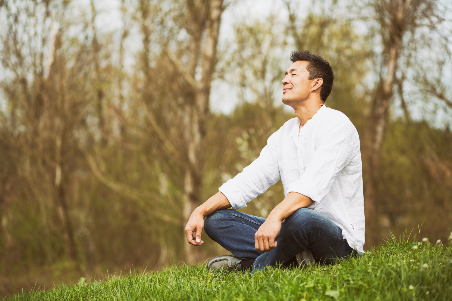 Japanese man sitting in nature